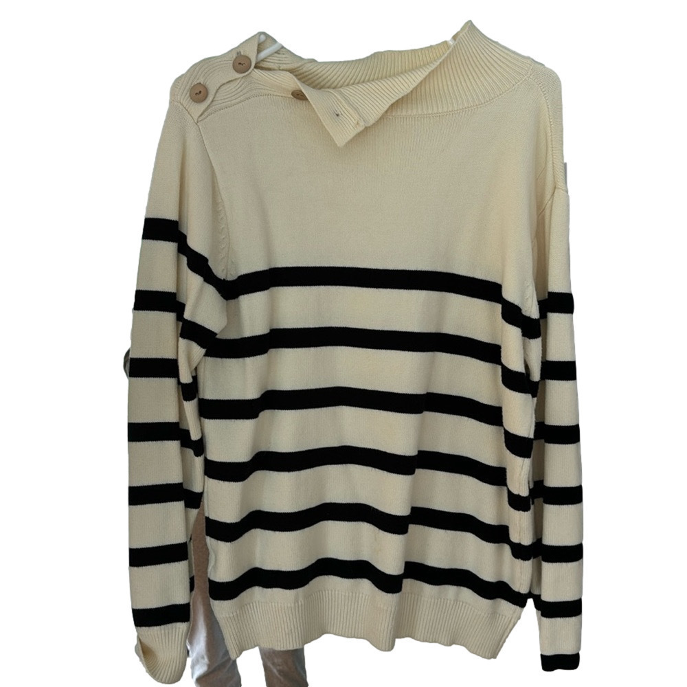 Black and‎ cream sweater with buttons up neck